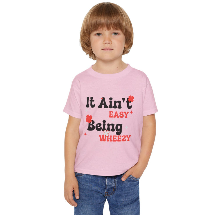 Vibrant Toddler T-Shirt with Fun Design - It Ain't Easy Being Wheezy, Cute Kids Tee, Playful Shirt for Toddlers, Birthday Gift, [...] - Bold PrintVibrant Toddler T-Shirt with Fun Design - It Ain't Easy Being Wheezy, Cute Kids Tee, Playful Shirt for Toddlers, Birthday Gift, [...]Kids clothesVibrant Toddler T-Shirt with Fun Design - It Ain't Easy Being Wheezy, Cute Kids Tee, Playful Shirt for Toddlers, Birthday Gift, [...]
